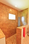 Master bath with walk-in shower and tile to the ceiling
