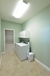 Laundry room with direct access to the master closet or garage