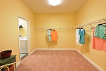 Master closet/dressing room with direct access to the laundry room