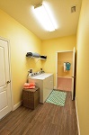 Laundry room with access to master closet, garage, and great room