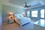 Master bedroom tray ceiling and charming bay window