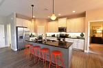 Kitchen features a corner pantry and standard 42in upper cabinets