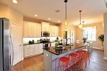 Kitchen with views to the dining room and pool beyond